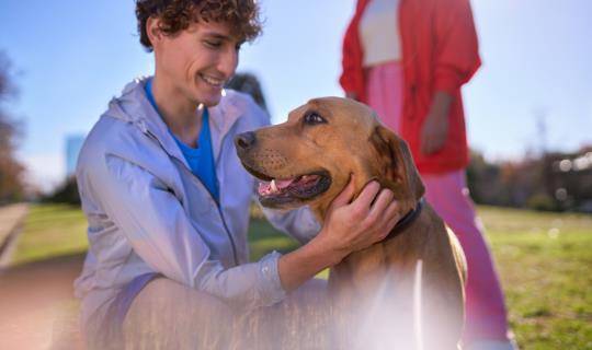 Young people in park with dog