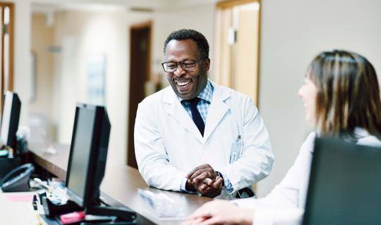 two veterinarians laughing