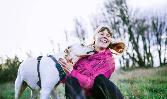 woman in park with dog
