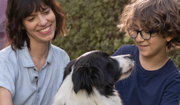woman and young boy with their dog