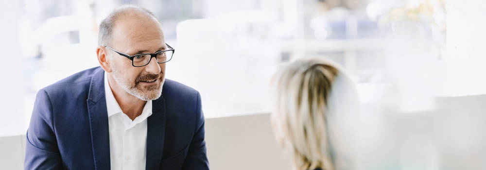 Salesman talking to woman