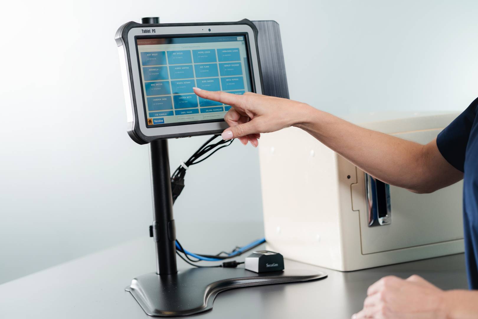 hand using touchpad on repleni trac vaultt