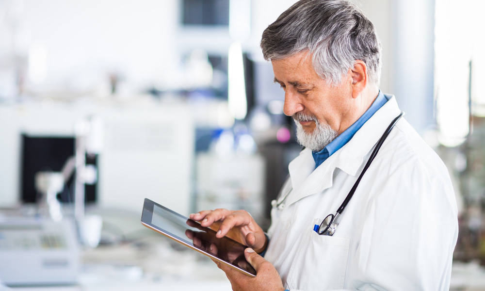 Veterinarian using tablet in clinic