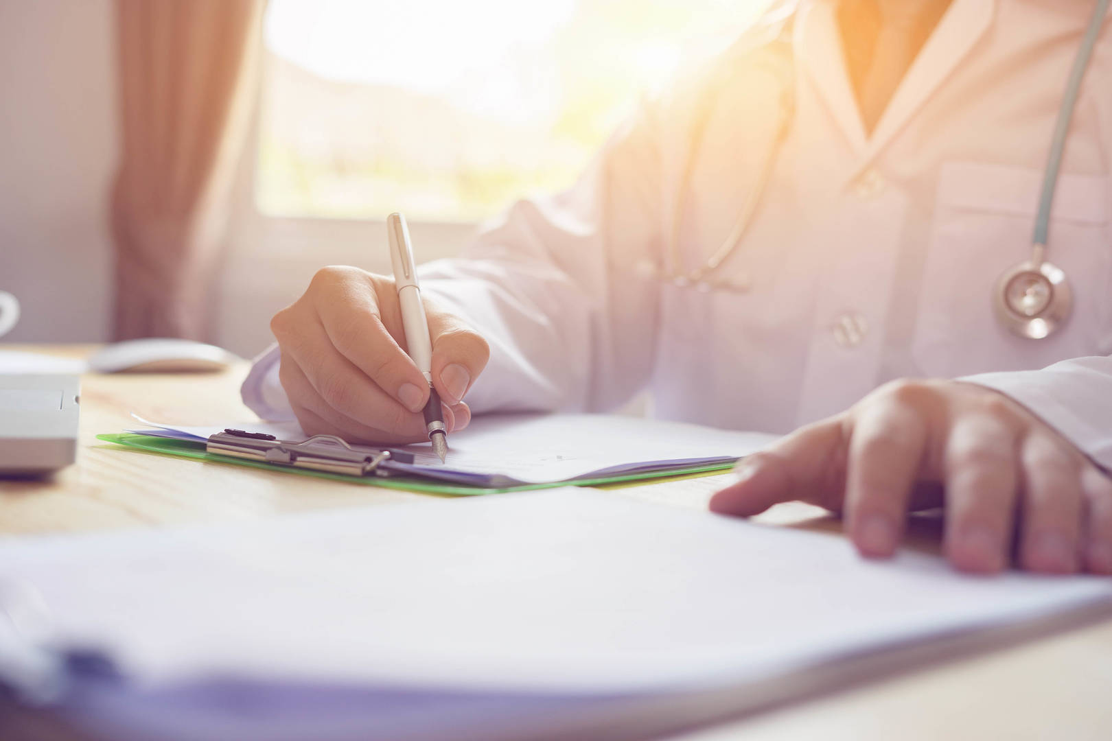 veterinarian taking notes on clipboard