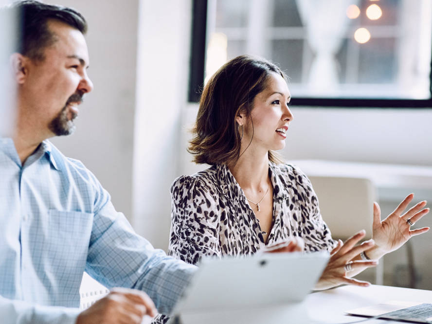 Man and woman at a conference table