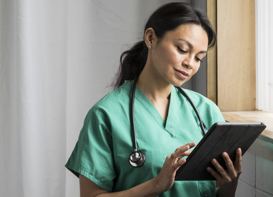 Vet tech shopping for veterinary products on a tablet